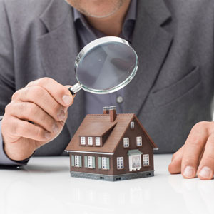 magnifying glass over model home commercial and residential property inspections